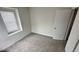 Cozy bedroom features neutral carpet and a window with natural light at 6005 Namozine Ct, Raleigh, NC 27610