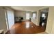 Open concept dining area with hardwood floors, chandelier, and access to living room at 6005 Namozine Ct, Raleigh, NC 27610