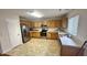 Well-lit kitchen showcasing stainless steel appliances and ample counter space at 6005 Namozine Ct, Raleigh, NC 27610