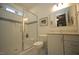 Bright bathroom featuring glass shower, white tile, and modern vanity at 615 Sampson St, Raleigh, NC 27609