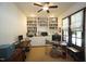 Bright home office featuring built-in bookshelves, ample workspace, and natural light at 615 Sampson St, Raleigh, NC 27609