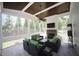 Cozy screened porch with a stone fireplace and comfortable seating at 615 Sampson St, Raleigh, NC 27609