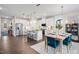 Bright, open-concept kitchen featuring stainless steel appliances, a center island, and a dining area at 66 Renshaw Dr, Fuquay Varina, NC 27526
