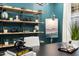 Stylish home office showcasing a modern desk, shelves, art, and decor for a productive workspace at 66 Renshaw Dr, Fuquay Varina, NC 27526