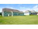 Expansive backyard with lush green lawn and inviting exterior of a well-maintained home at 67 Bornean Dr, Garner, NC 27529