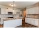 Bright kitchen boasting stainless steel appliances, white cabinets, and granite countertops at 67 Bornean Dr, Garner, NC 27529