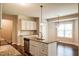 Gourmet kitchen with stainless steel appliances, granite countertops, and white cabinets at 67 Bornean Dr, Garner, NC 27529