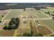 An aerial view of the neighborhood and surrounding fields at 7055 Nc-242, Dunn, NC 28334