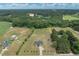 An aerial view of a sprawling home and property showcasing its landscaped grounds at 7055 Nc-242, Dunn, NC 28334