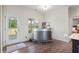 Bright bar area with unique metal bar, view to backyard, and access to the backyard at 7055 Nc-242, Dunn, NC 28334