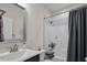 Bathroom with a sink, toilet and tub shower combo at 7055 Nc-242, Dunn, NC 28334