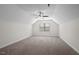 Bonus room featuring neutral walls, carpet, ceiling fan and a sunlit window at 7055 Nc-242, Dunn, NC 28334