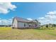 Exterior view of a single-Gathering home with a covered patio and large lawn at 7055 Nc-242, Dunn, NC 28334