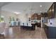 Well-lit kitchen with stainless steel appliances, central island with seating, and modern finishes at 7055 Nc-242, Dunn, NC 28334