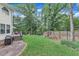 Fenced backyard with a wooden deck, stone ground cover and a swing set at 7613 Percy Ct, Raleigh, NC 27613