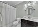 Bathroom with a shower/tub combo and white countertops at 7613 Percy Ct, Raleigh, NC 27613