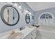 Bathroom features double sinks, vanity and a soaking tub at 7613 Percy Ct, Raleigh, NC 27613