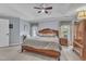 Spacious bedroom with a large bed, ceiling fan and plenty of natural light at 7613 Percy Ct, Raleigh, NC 27613