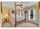 Bedroom with a four poster bed, ceiling fan and 2 windows at 7613 Percy Ct, Raleigh, NC 27613