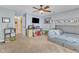 A blue painted bedroom is furnished with a grey bunk bed and a ceiling fan at 7613 Percy Ct, Raleigh, NC 27613