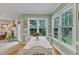 Bright eat-in kitchen featuring a white table with flowers, hardwood floors, and plenty of natural light at 7613 Percy Ct, Raleigh, NC 27613
