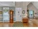 Open foyer with grand ceilings, hardwood floors, an area rug and traditional decor at 7613 Percy Ct, Raleigh, NC 27613