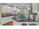 Updated kitchen with granite countertops, a tile backsplash, stainless steel appliances, and a center island at 7613 Percy Ct, Raleigh, NC 27613