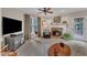 Inviting living room features a fireplace, neutral decor and carpet floors at 7613 Percy Ct, Raleigh, NC 27613