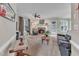 Bright and cozy living room with a brick fireplace, ceiling fan and carpet flooring at 7613 Percy Ct, Raleigh, NC 27613