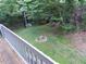 Backyard view with grass and small fire pit encircled by decorative stones at 875 Mlk Jr Boulevard,15, Chapel Hill, NC 27514