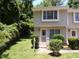Inviting townhouse featuring manicured landscaping and a charming entryway with a well-lit front porch at 875 Mlk Jr Boulevard,15, Chapel Hill, NC 27514