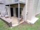 Cozy outdoor patio space featuring a chair and access to the home's interior via sliding glass door at 875 Mlk Jr Boulevard,15, Chapel Hill, NC 27514