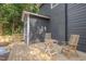 New wooden deck with chairs, with charcoal siding exterior, and a view of the yard at 924 W Trinity Ave, Durham, NC 27701