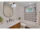 Modern bathroom with patterned tile, updated fixtures, and plenty of natural light at 924 W Trinity Ave, Durham, NC 27701