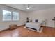 Bright bedroom with a large window, hardwood floors, and a peaceful atmosphere at 924 W Trinity Ave, Durham, NC 27701