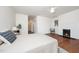 Bright primary bedroom showcasing a cozy fireplace, and a ceiling fan at 924 W Trinity Ave, Durham, NC 27701