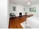 Spacious bedroom with a white brick fireplace, and windows bringing in natural light at 924 W Trinity Ave, Durham, NC 27701