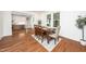 Cozy dining room with wooden table set for four, next to the kitchen at 924 W Trinity Ave, Durham, NC 27701