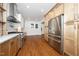 Bright kitchen featuring stainless steel appliances and custom cabinetry at 924 W Trinity Ave, Durham, NC 27701