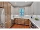 Modern kitchen with custom cabinetry, stainless steel appliances, and granite countertops at 924 W Trinity Ave, Durham, NC 27701