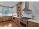 Well-appointed kitchen featuring high-end appliances, custom cabinets, and bright lighting at 924 W Trinity Ave, Durham, NC 27701