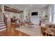 Cozy living room with hardwood floors, fireplace, and a comfortable seating arrangement at 924 W Trinity Ave, Durham, NC 27701