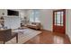 Bright living room with hardwood floors, a fireplace, and natural light from the windows at 924 W Trinity Ave, Durham, NC 27701
