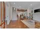 Open-concept home featuring hardwood floors, a fireplace, and an open dining area at 924 W Trinity Ave, Durham, NC 27701