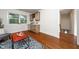 Sitting room with a wet bar featuring upper and lower cabinetry, granite countertops and mini fridge at 924 W Trinity Ave, Durham, NC 27701