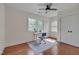 Sun-filled office with hardwood floors and a white desk bathed in natural light from bright windows at 924 W Trinity Ave, Durham, NC 27701