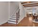 Inviting staircase with wood treads and wrought iron railing, complemented by exposed beams at 924 W Trinity Ave, Durham, NC 27701