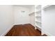 Large walk-in closet with white shelving, offering ample storage and organization space at 924 W Trinity Ave, Durham, NC 27701