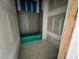 Bathroom under construction with gray subway tile, a shelf, and green tub at 1025 Coldspring Circle, Durham, NC 27705