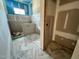 Bathroom under construction featuring marble floors, subway tile and blue accent walls at 1025 Coldspring Circle, Durham, NC 27705